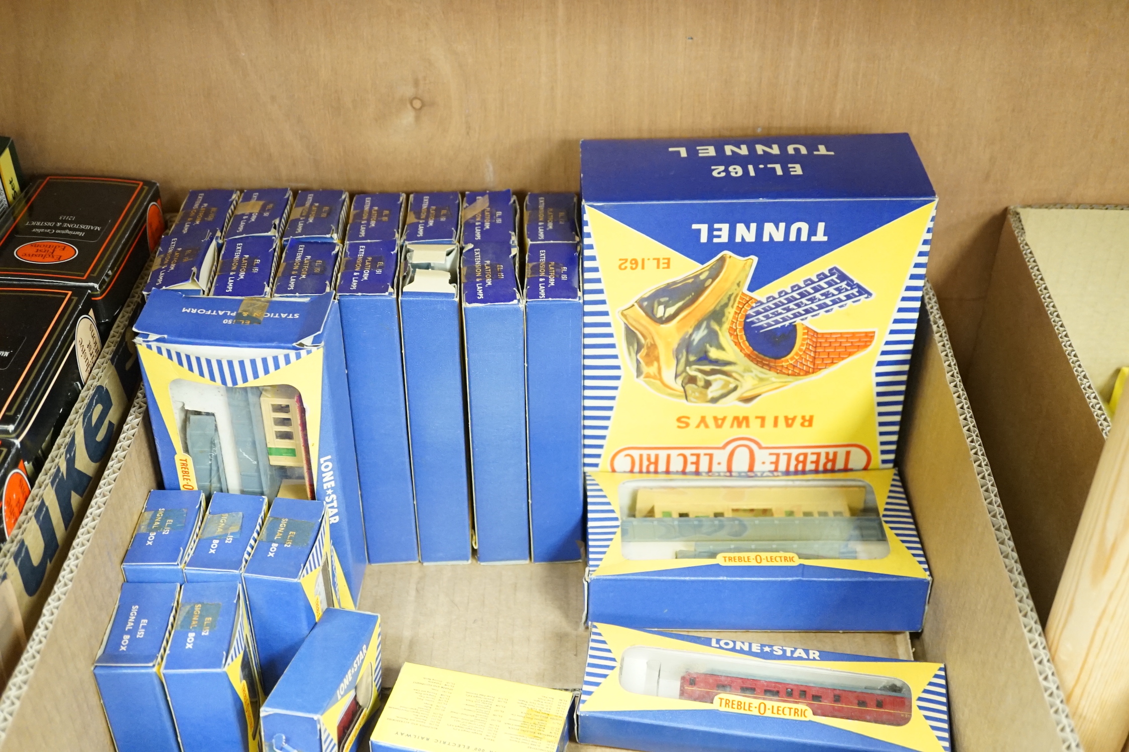 Seventy-two boxed items of Lone Star 000 gauge model railway including; a tunnel, Brake End Coaches, bogie wagons, station platforms, platform extensions, signal boxes, box vans, and telegraph poles
